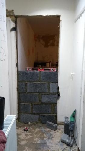 Creating a new doorway and blocking up the old one 